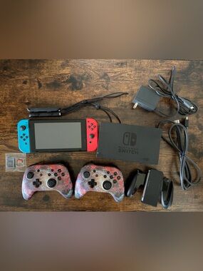 Nintendo Switch Console Bundle with Red & Blue Joy-Con and Galaxy Controllers